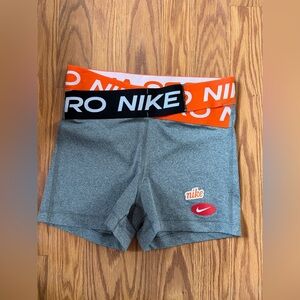 Nike Women's Gray Athletic Shorts with Orange Waistband